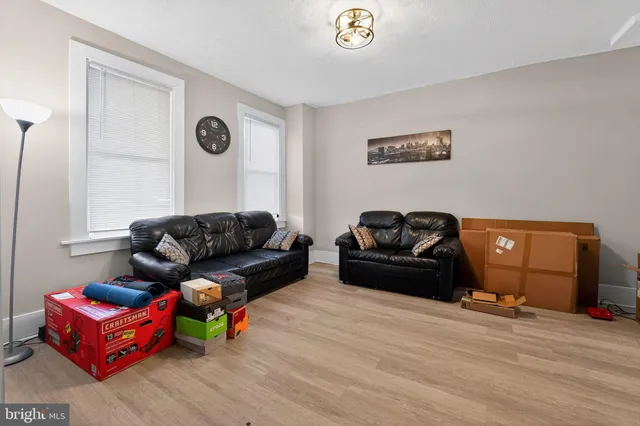 a view of a livingroom with furniture and a flat screen tv