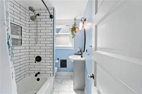 a bathroom with a sink and mirror