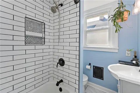 a bathroom with a sink and a shower