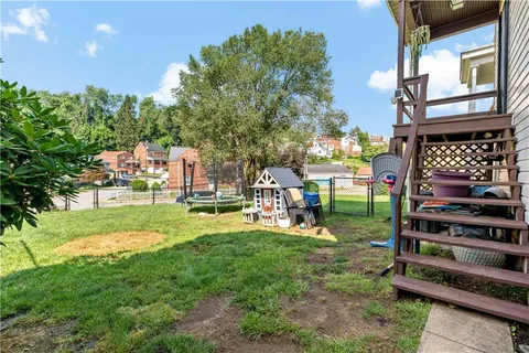 a view of a park with swings and slides