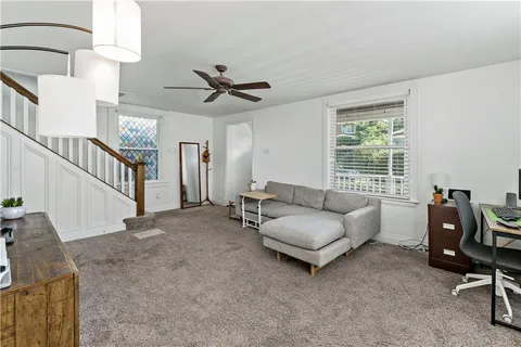 a living room with furniture and a window
