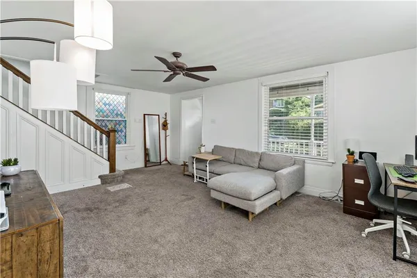 a living room with furniture and a window