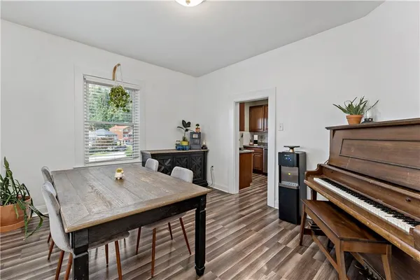 a view of a dining room with furniture window and wooden floor