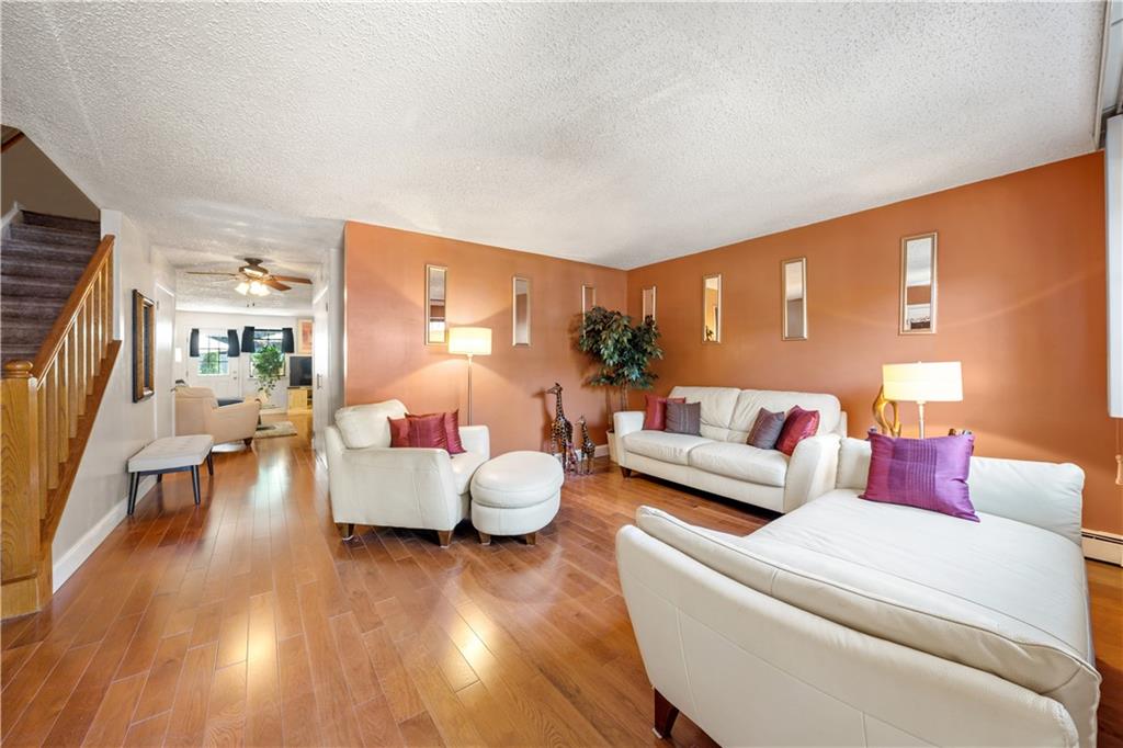 888 Gates Avenue Brooklyn, NY 11221 - Photo 1 of 18 a living room with furniture and a large window