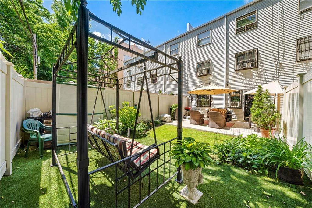 888 Gates Avenue Brooklyn, NY 11221 - Photo 11 of 18 a view of an house with backyard and patio