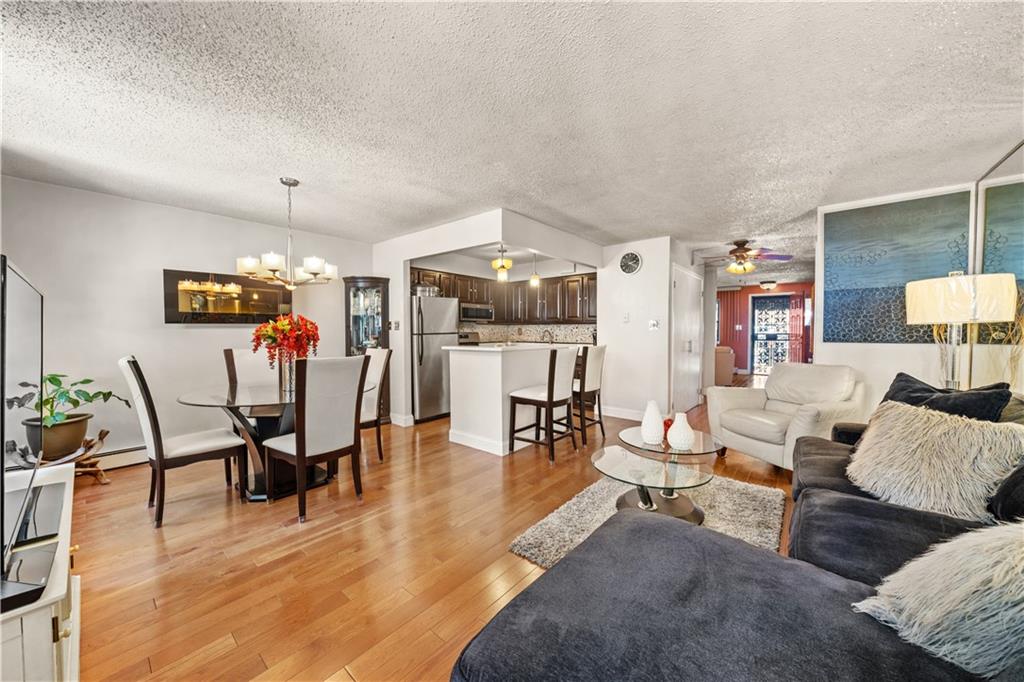 888 Gates Avenue Brooklyn, NY 11221 - Photo 4 of 18 a living room with furniture and wooden floor