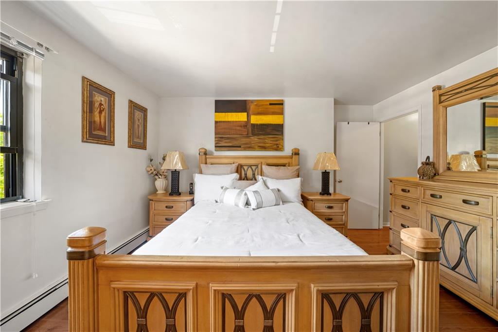 888 Gates Avenue Brooklyn, NY 11221 - Photo 9 of 18 a bedroom with a bed a table and chair