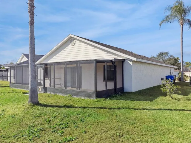 a front view of a house with a garden and yard