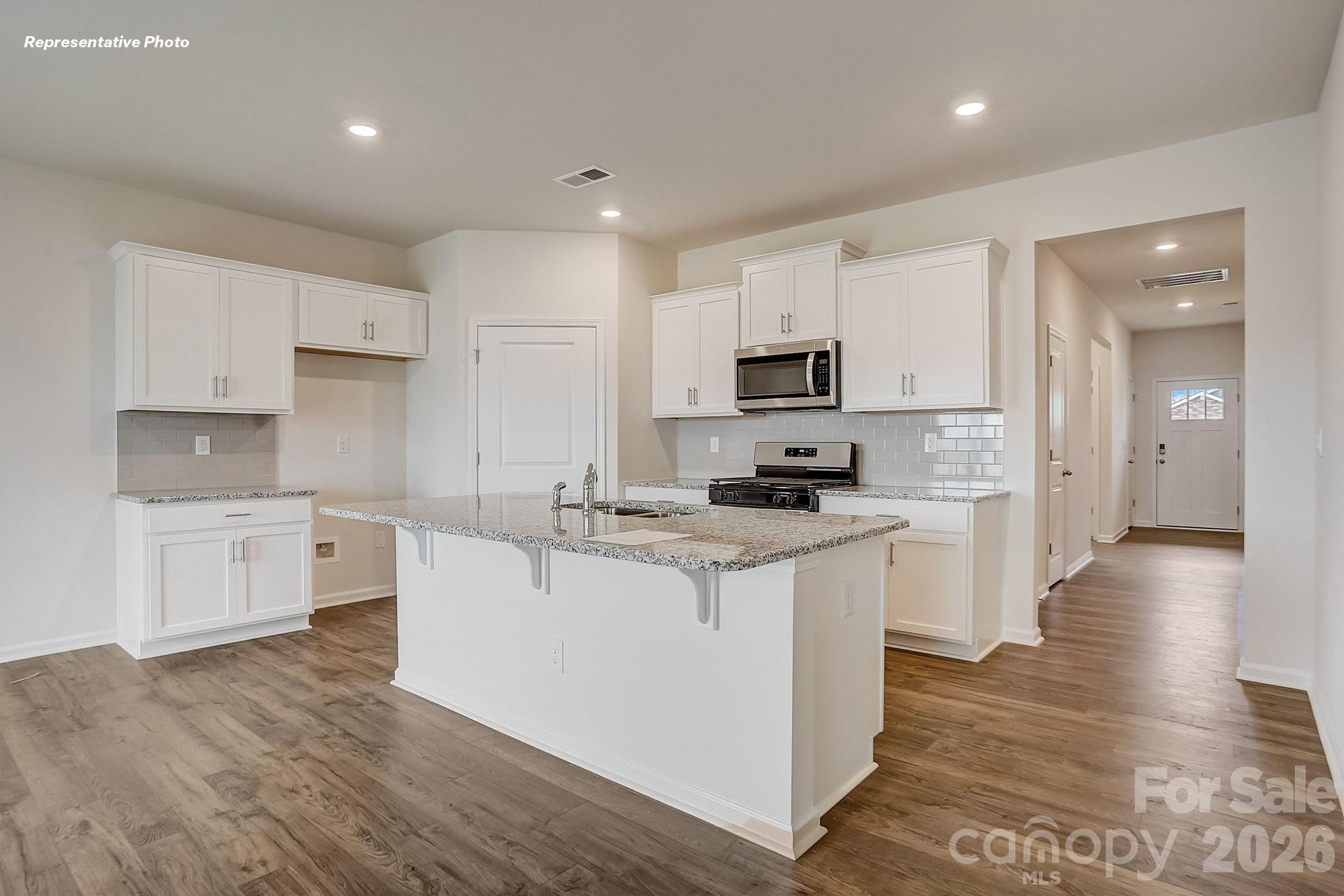 1028 Horizon Lane Chester, SC 29706 - Photo 7 of 24 a large kitchen with stainless steel appliances lots of counter space and wooden floor