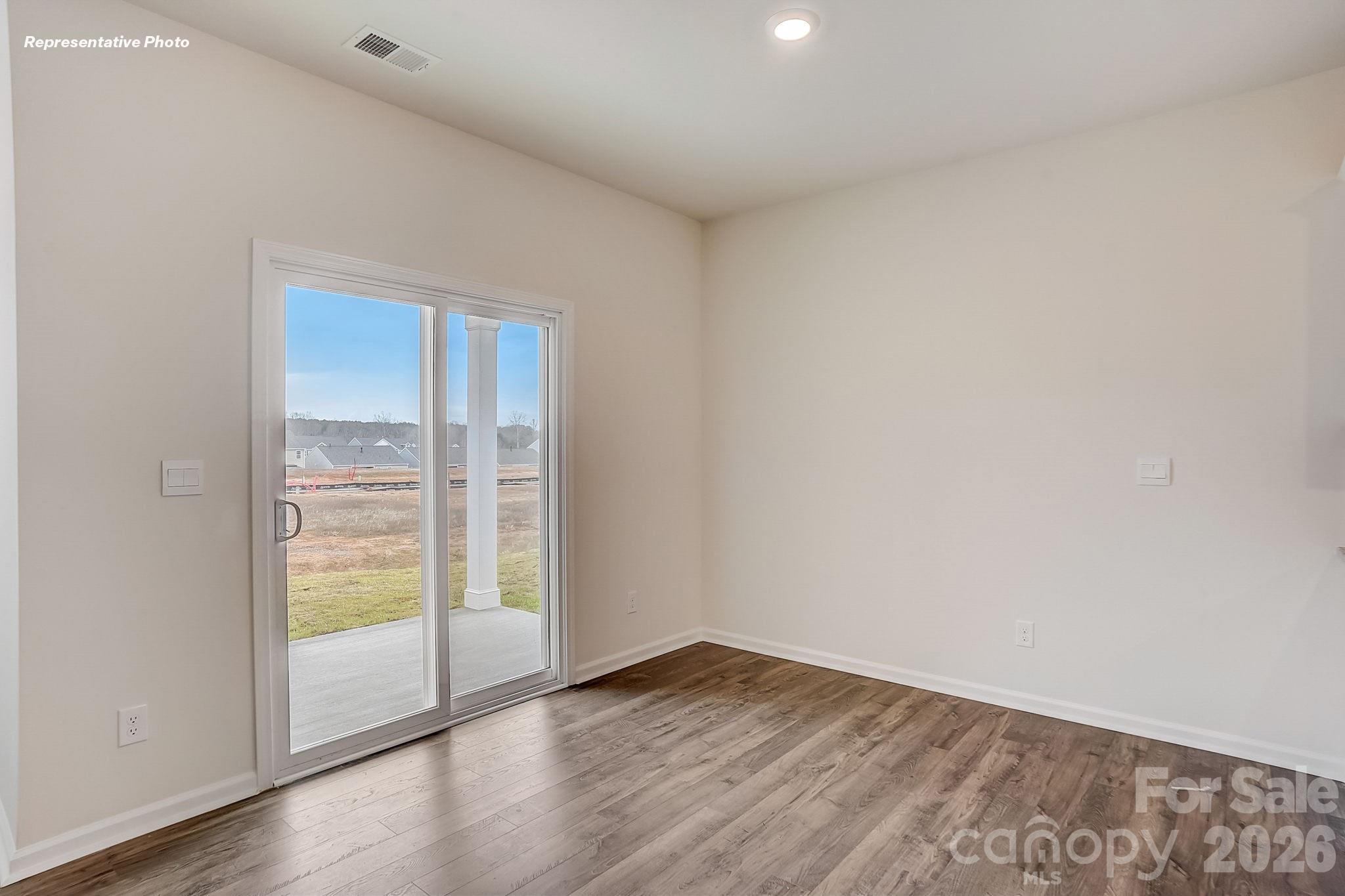 1028 Horizon Lane Chester, SC 29706 - Photo 10 of 24 a view of an empty room with wooden floor and a window