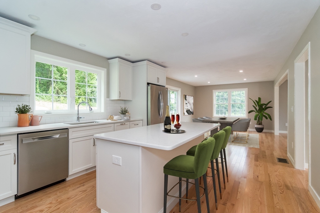 41 Martin Road Douglas, MA 01516 - Photo 11 of 32 a kitchen with sink table and chairs