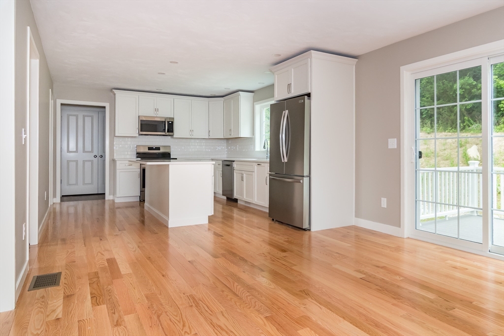 41 Martin Road Douglas, MA 01516 - Photo 14 of 32 a kitchen with stainless steel appliances a refrigerator and a stove top oven