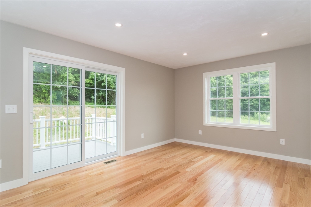 41 Martin Road Douglas, MA 01516 - Photo 17 of 32 a view of empty room with wooden floor and fan
