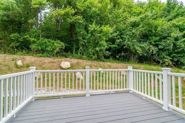 a view of balcony with wooden floor