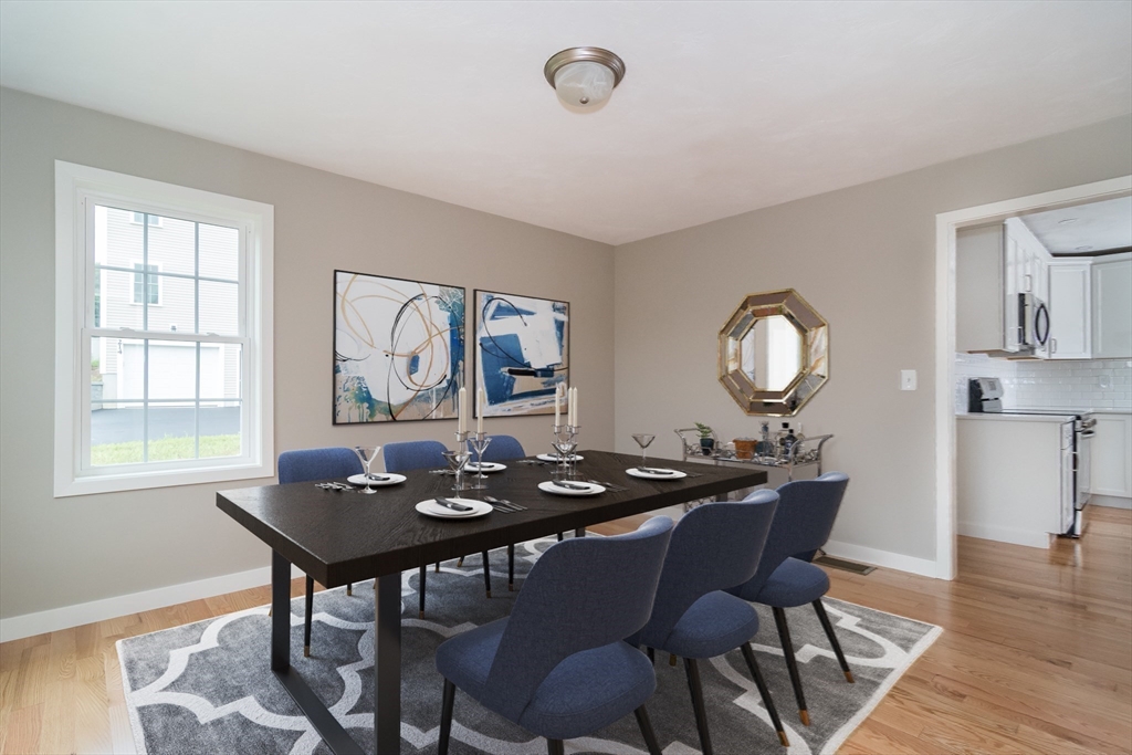 41 Martin Road Douglas, MA 01516 - Photo 19 of 32 a dining room with furniture a window and wooden floor