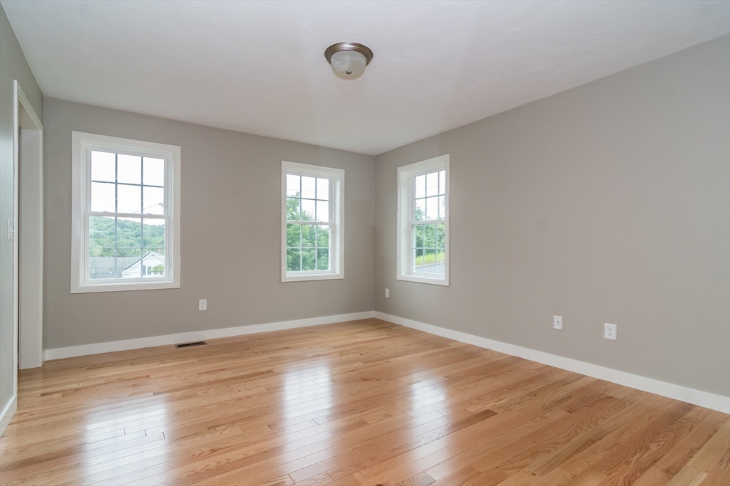 41 Martin Road Douglas, MA 01516 - Photo 20 of 32 a view of an empty room with wooden floor and a window