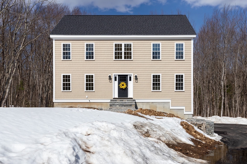 41 Martin Road Douglas, MA 01516 - Photo 2 of 32 a front view of a house with a yard