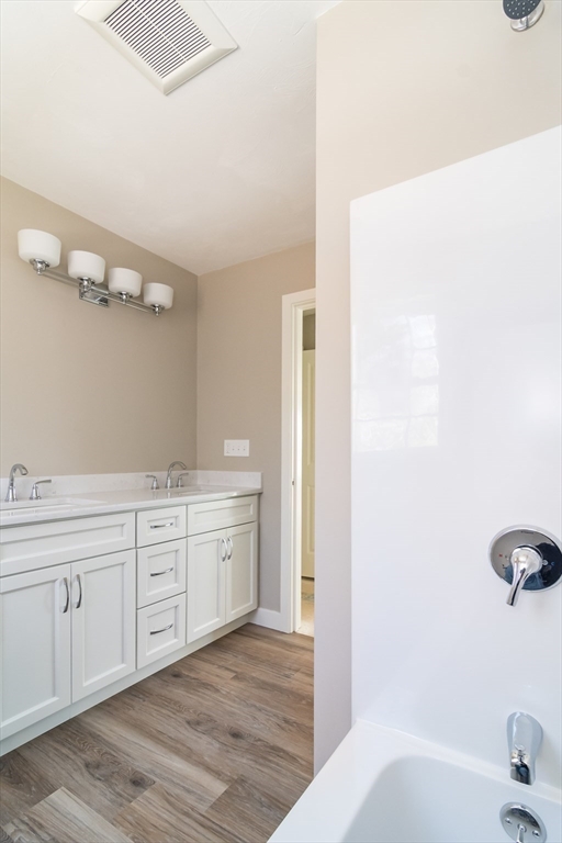 41 Martin Road Douglas, MA 01516 - Photo 26 of 32 a spacious bathroom with a tub sink and mirror