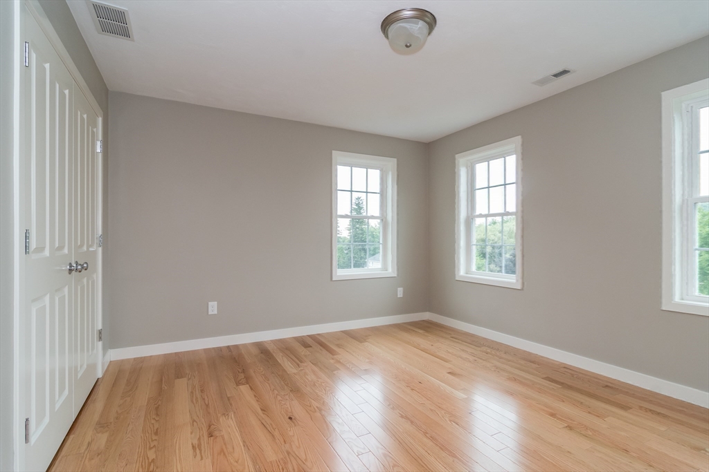 41 Martin Road Douglas, MA 01516 - Photo 29 of 32 a view of empty room with wooden floor and fan