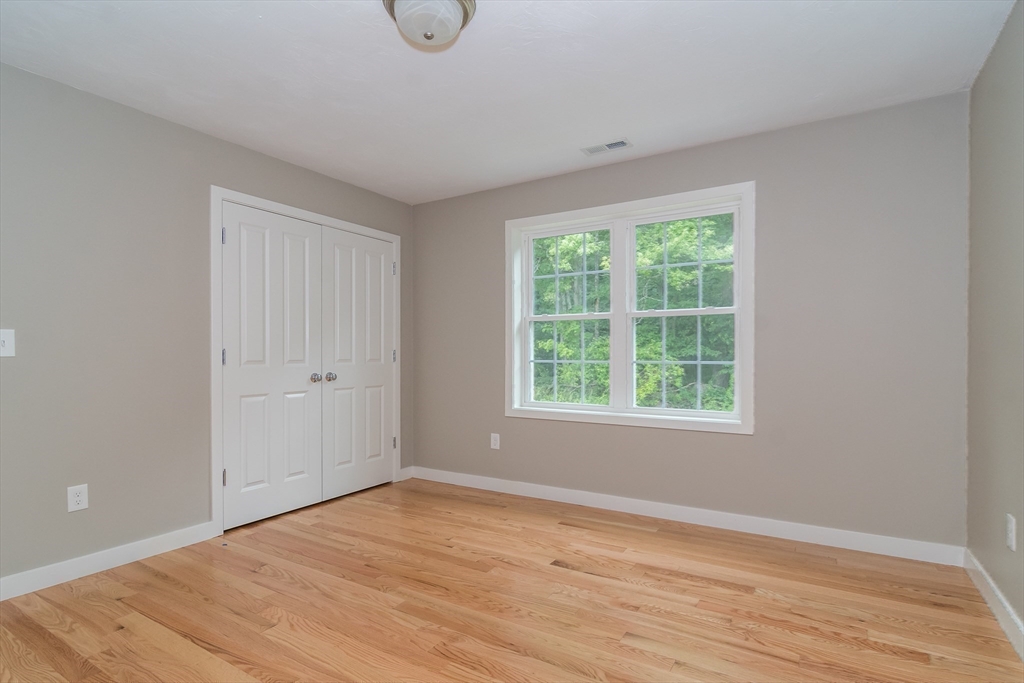 41 Martin Road Douglas, MA 01516 - Photo 30 of 32 a view of an empty room with wooden floor and a window