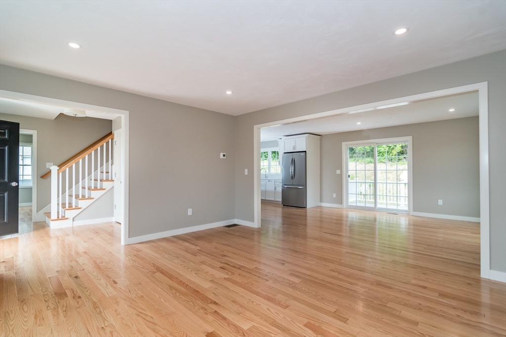 41 Martin Road Douglas, MA 01516 - Photo 5 of 32 a view of an empty room with wooden floor and a window