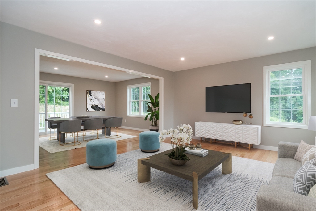 41 Martin Road Douglas, MA 01516 - Photo 6 of 32 a living room with furniture and a flat screen tv
