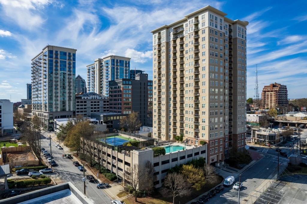 325 East Paces Ferry Road Northeast, Unit 1202 Atlanta, GA 30305 - Photo 1 of 1 Welcome to Paces 325 Condos. Gated parking garage is attached with an outdoor pool, tennis courts and grilling area.