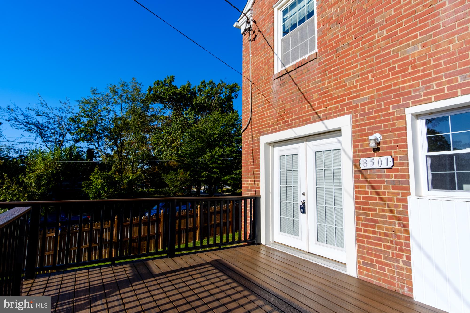 8501 Pleasant Plains Road Baltimore, MD 21286 - Photo 15 of 53 a view of a brick house with a small yard