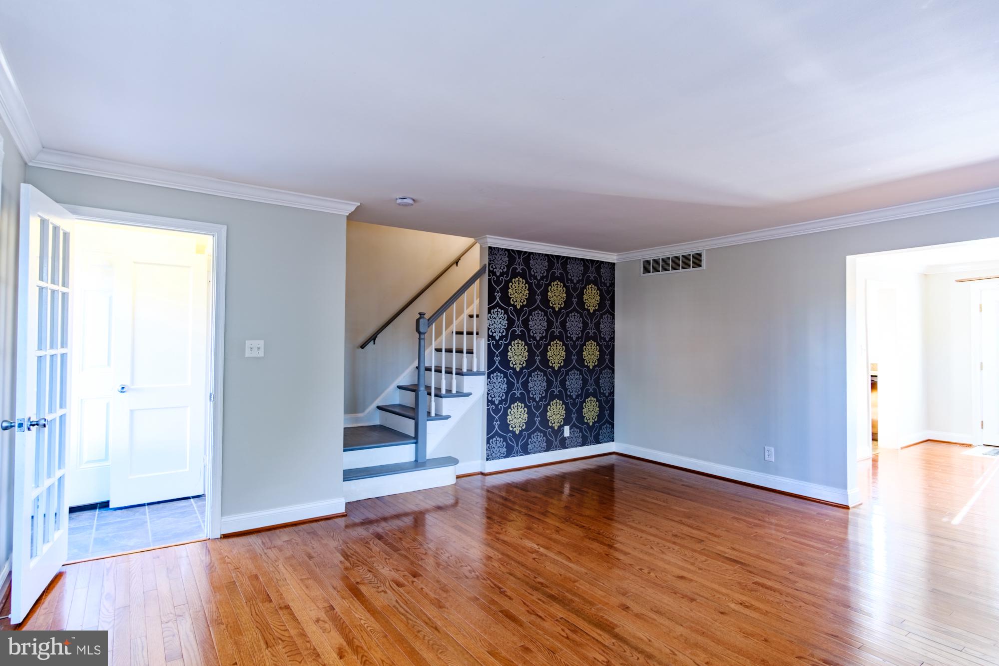 8501 Pleasant Plains Road Baltimore, MD 21286 - Photo 20 of 53 a view of empty room with wooden floor and fan