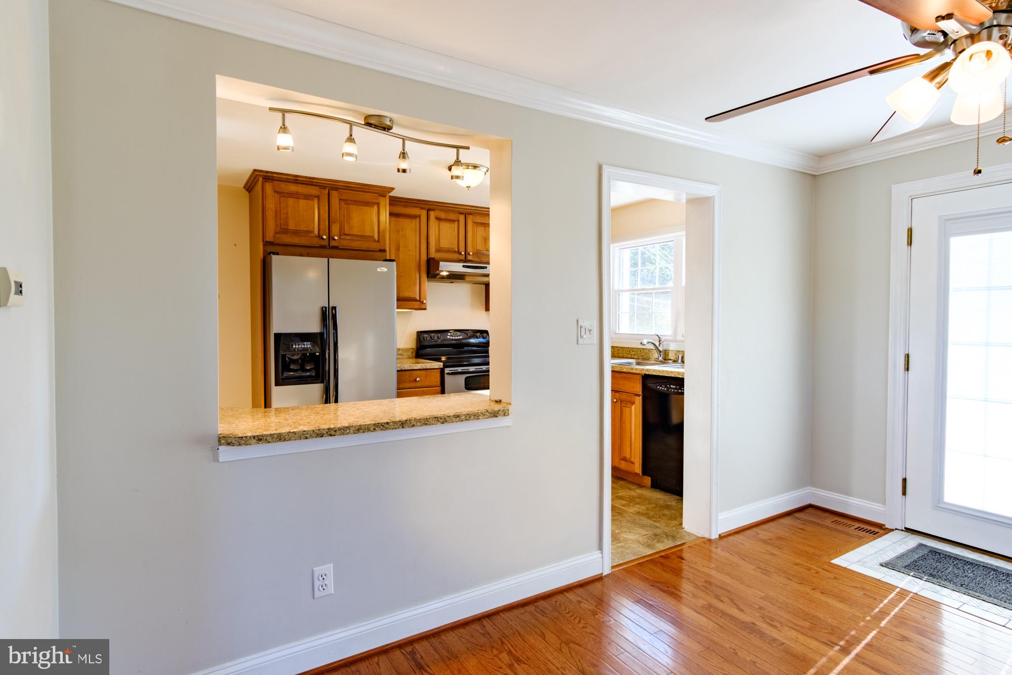 8501 Pleasant Plains Road Baltimore, MD 21286 - Photo 26 of 53 a view of a room with wooden floor and windows