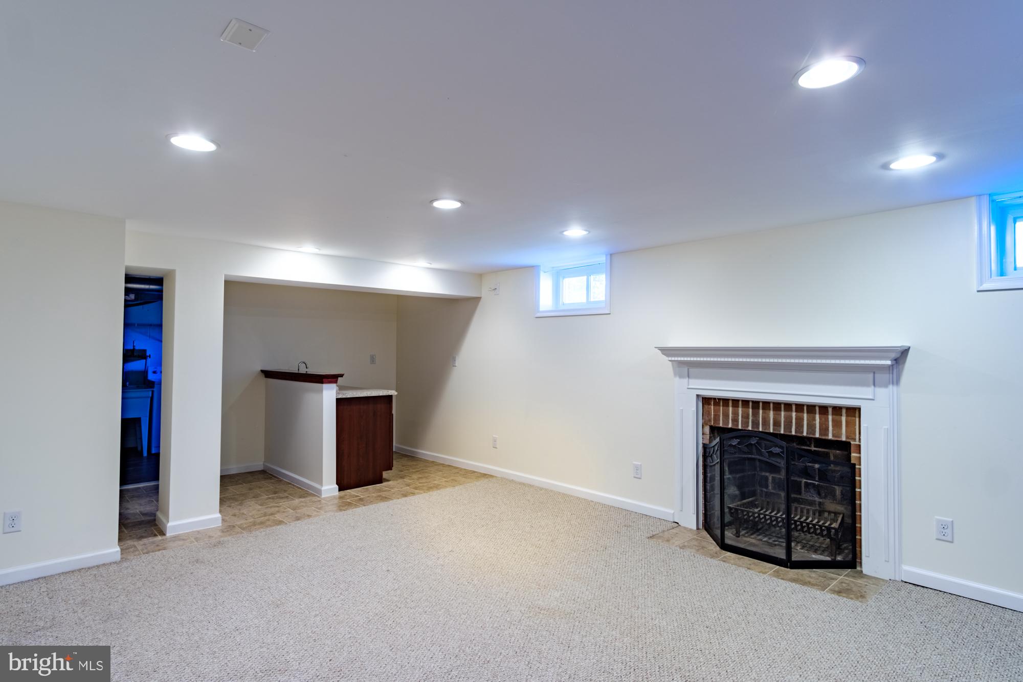 8501 Pleasant Plains Road Baltimore, MD 21286 - Photo 32 of 53 a view of an empty room with a fireplace