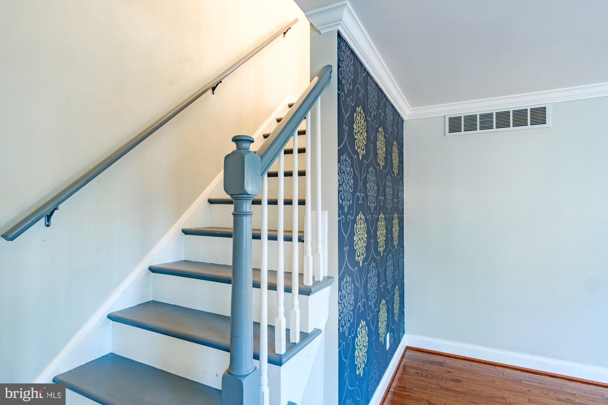 8501 Pleasant Plains Road Baltimore, MD 21286 - Photo 41 of 53 a view of staircase with wooden floor and white walls