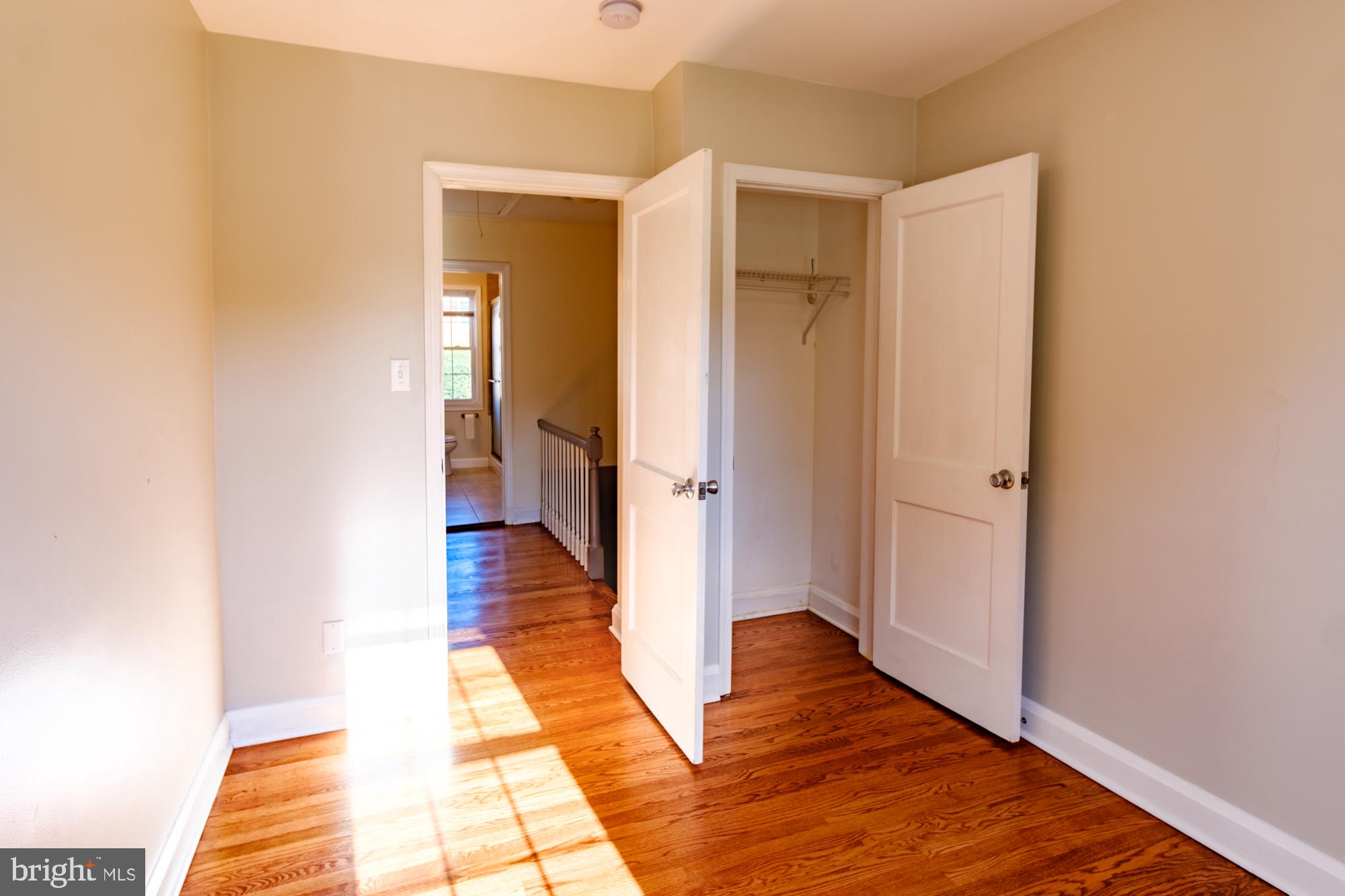8501 Pleasant Plains Road Baltimore, MD 21286 - Photo 50 of 53 a view of a hallway with wooden floor and staircase