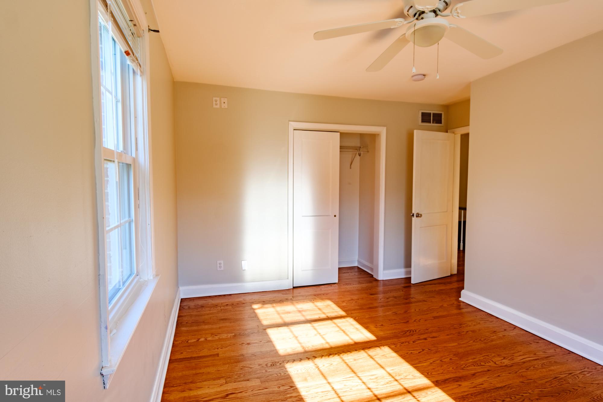 8501 Pleasant Plains Road Baltimore, MD 21286 - Photo 53 of 53 a view of a room with wooden floor and door