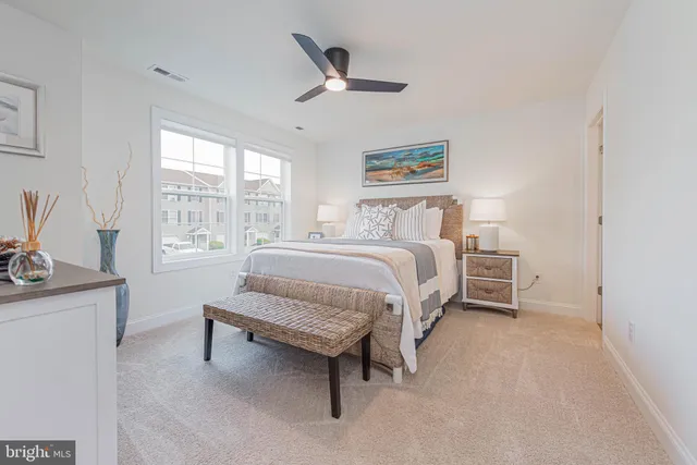 a bedroom with a bed and a couch