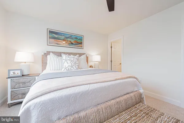 a bedroom with a bed and lamp