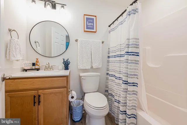a bathroom with a toilet sink and a bathtub