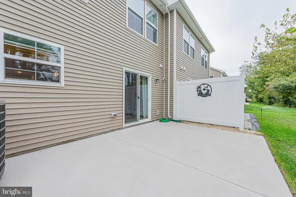 a view of a house with a yard and a garage