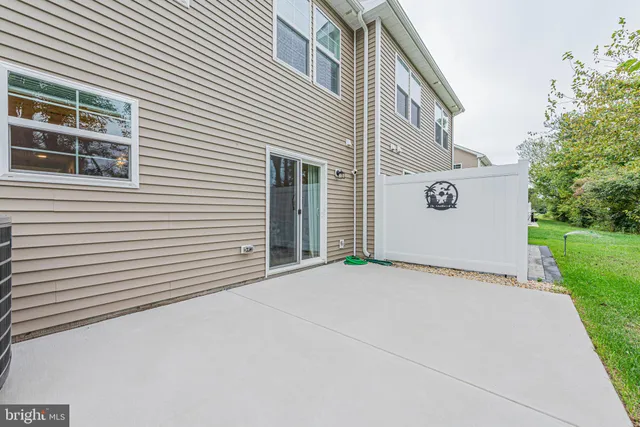 a view of a house with a yard and a garage