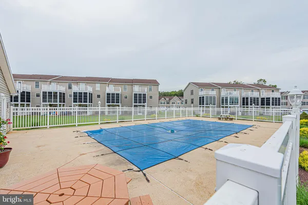 a view of swimming pool in front of house