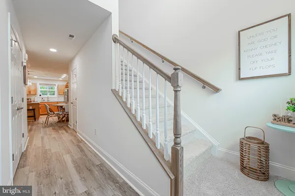 a view of hallway with livingroom and furniture