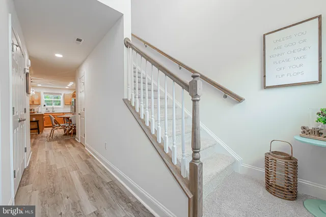 a view of hallway with livingroom and furniture