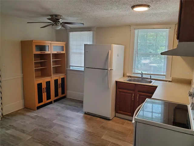 a bathroom with a sink and a shower curtain