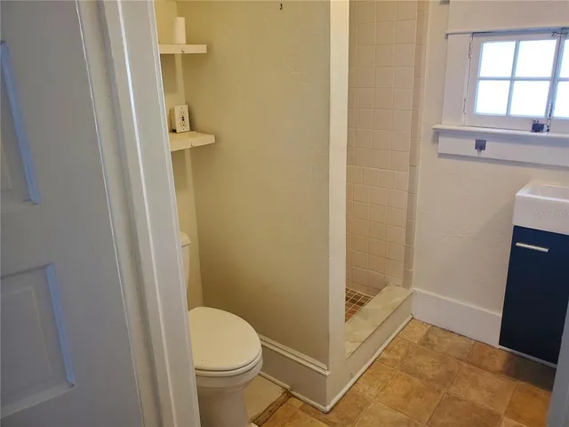 a bathroom with a toilet and a sink