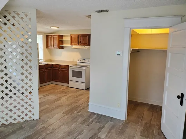 a living room with furniture a rug and a window