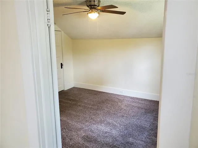 a view of a deck with a table and chairs with wooden floor