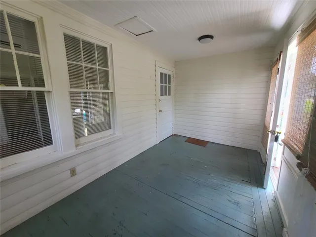 wooden floor in an empty room with a fireplace