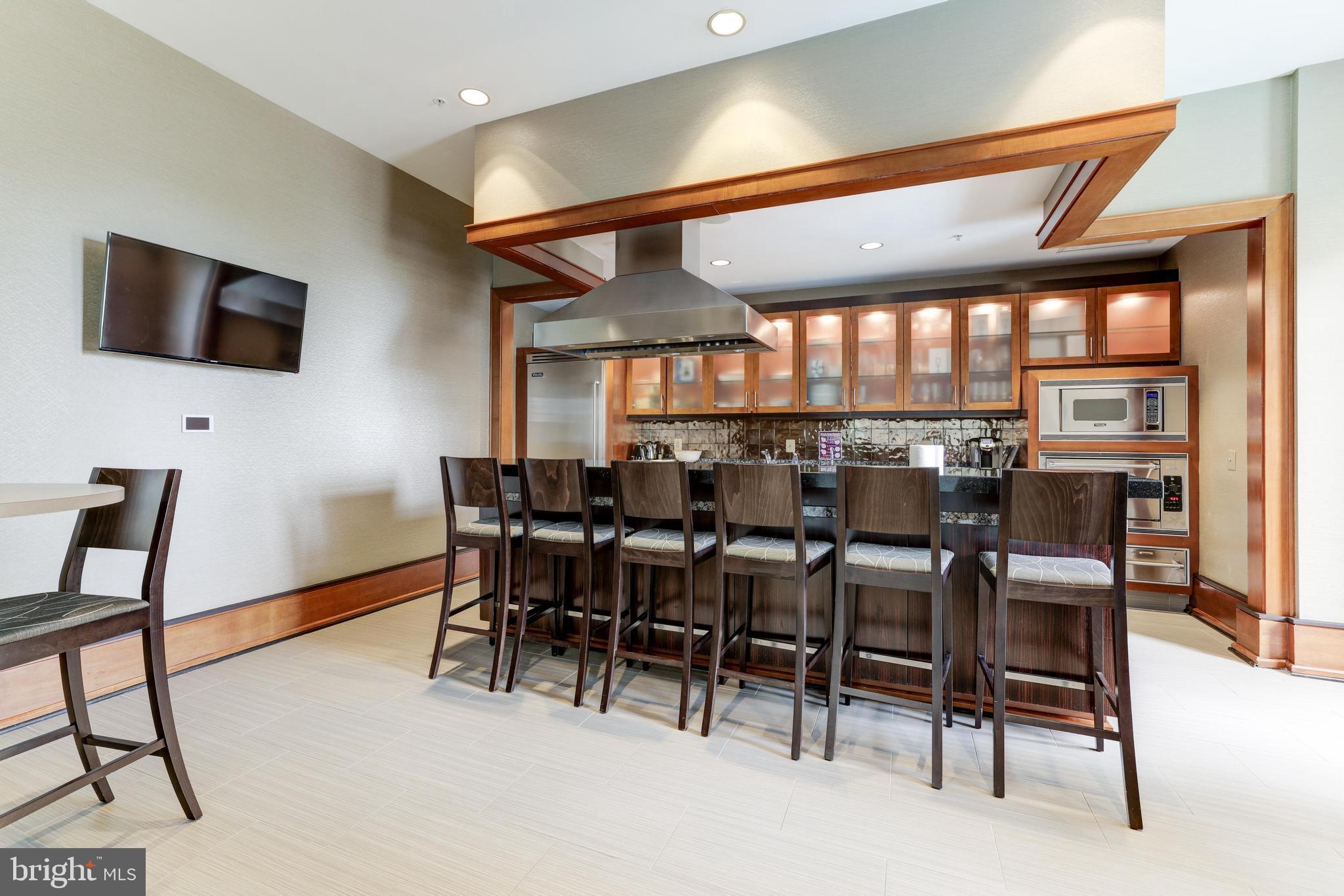11990 Market Street, Unit 414 Reston, VA 20190 - Photo 36 of 52 a view of a dining room with furniture