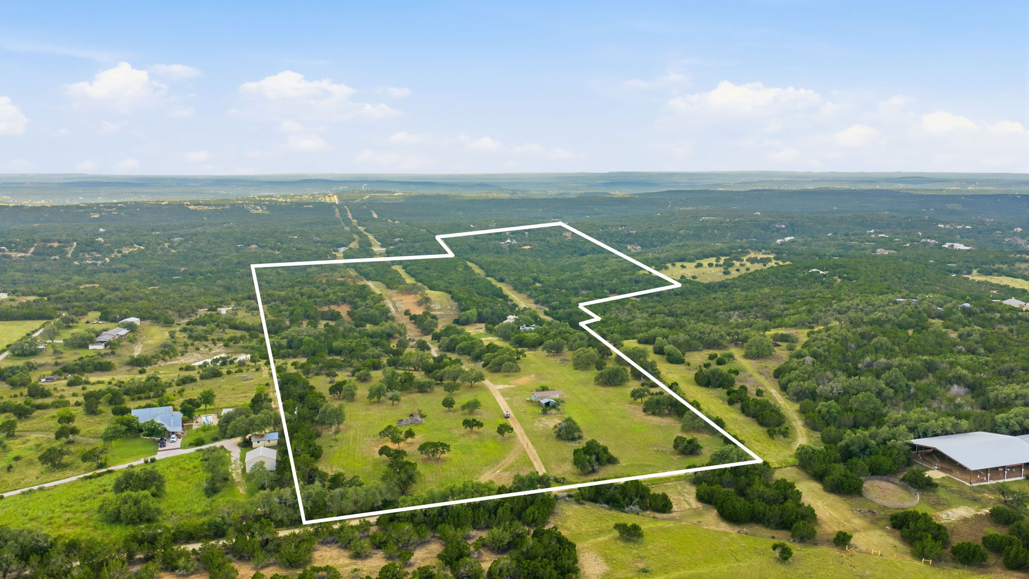 3230 West Fitzhugh Road Dripping Springs, TX 78620 - Photo 5 of 34 Discover vast, rolling acreage with mature trees, offering serene natural beauty and endless possibilities.