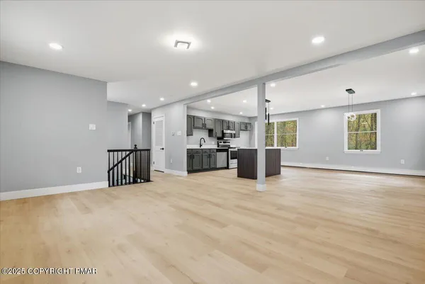 a kitchen with a sink cabinets and window